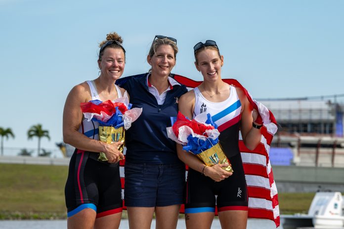 USRowing CEO Amanda Kraus (center) with the 2024 U.S. Olympic pair (fourth) of Washington's Jess Thoennes (left) and Stanford's Azja Czajkowski at the 2024 U.S. Olympic & Paralympic Team Trials – Rowing at Nathan Benderson Park in Sarasota, Fla. PHOTO: Lisa Worthy.